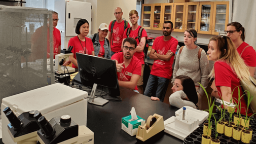Past member, Juan, explaining research to LPS Teachers for Research Experience for Teachers Program