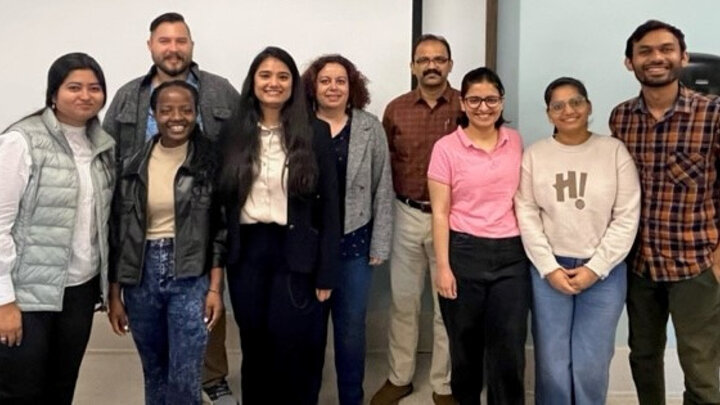 Heena Puri pictured with members from the Plant-Insect Interactions Lab