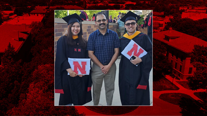 Mia Luong and Juan Betancurt Cardona with their advisor, Dr. Joe Louis, at the May 2022 Graduate Commencement