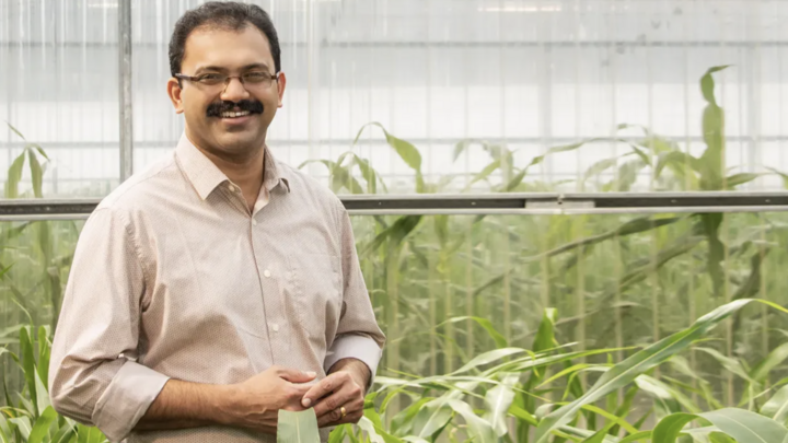 Dr. Joe Louis in greenhouse research facility