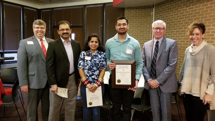 Grover pictured with Dr. John Ruberson, Dr. Archie Clutter and Dr. Tiffany Heng-Moss
